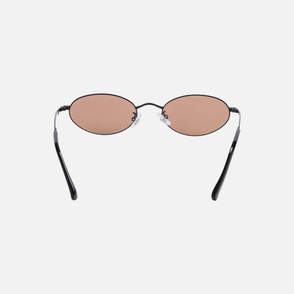 Miraje oval sunglasses with black metal frames and amber-tinted lenses, viewed from the back.
