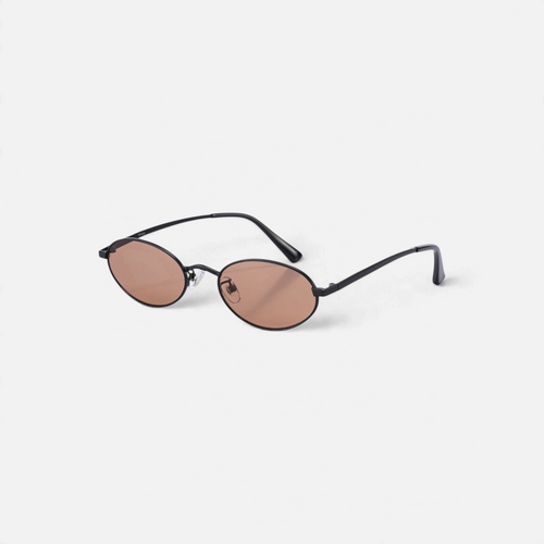 Miraje oval frame sunglasses with a lightweight black metal frame and warm amber-tinted lenses on a white background.
