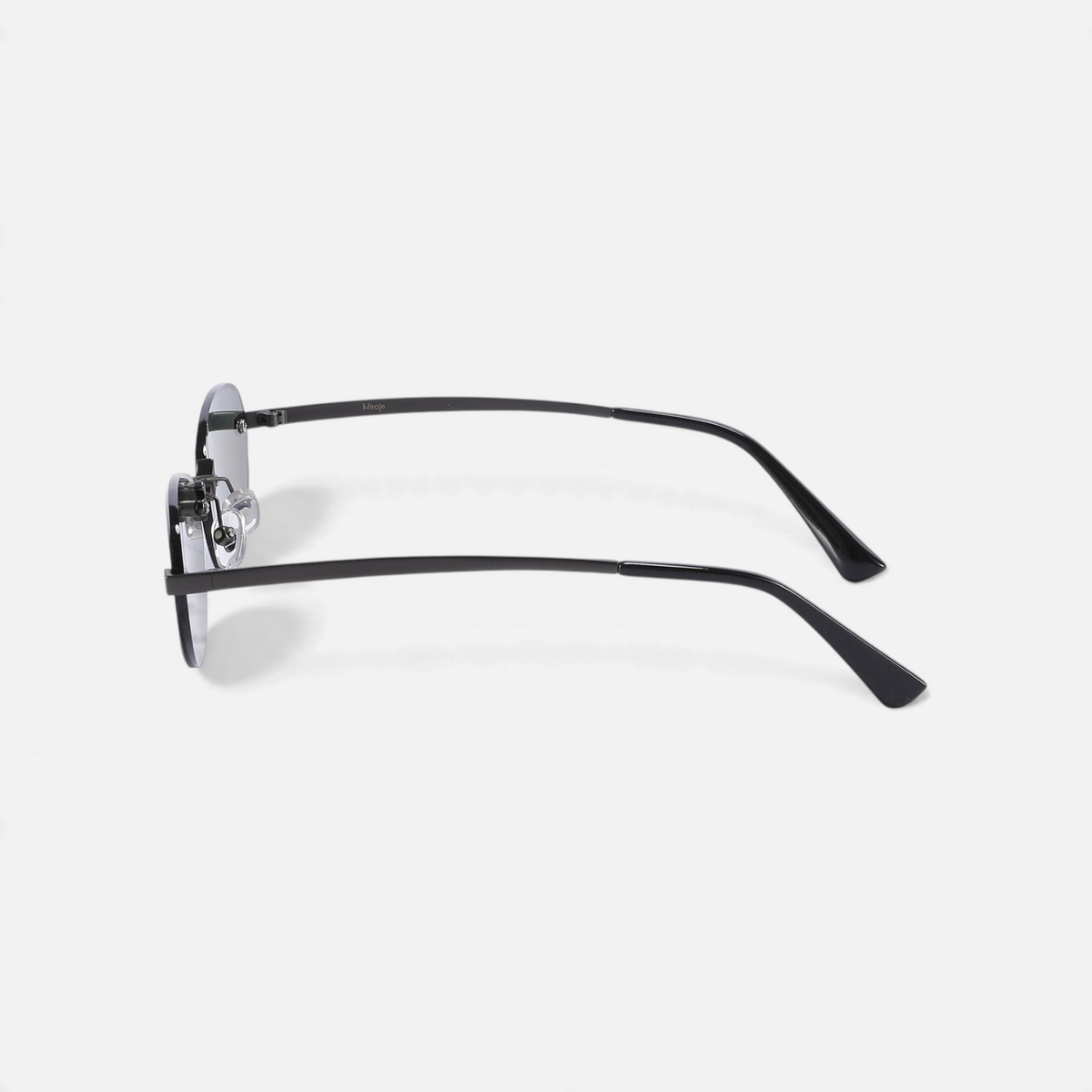 Miraje oval rimless sunglasses with gunmetal metal frames and dark tinted lenses, side profile view